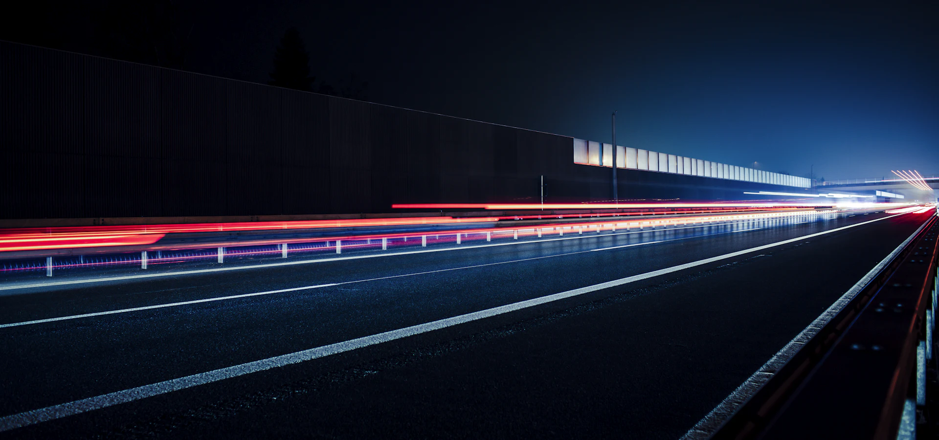 Light trails from traffic on a motorway at dusk
