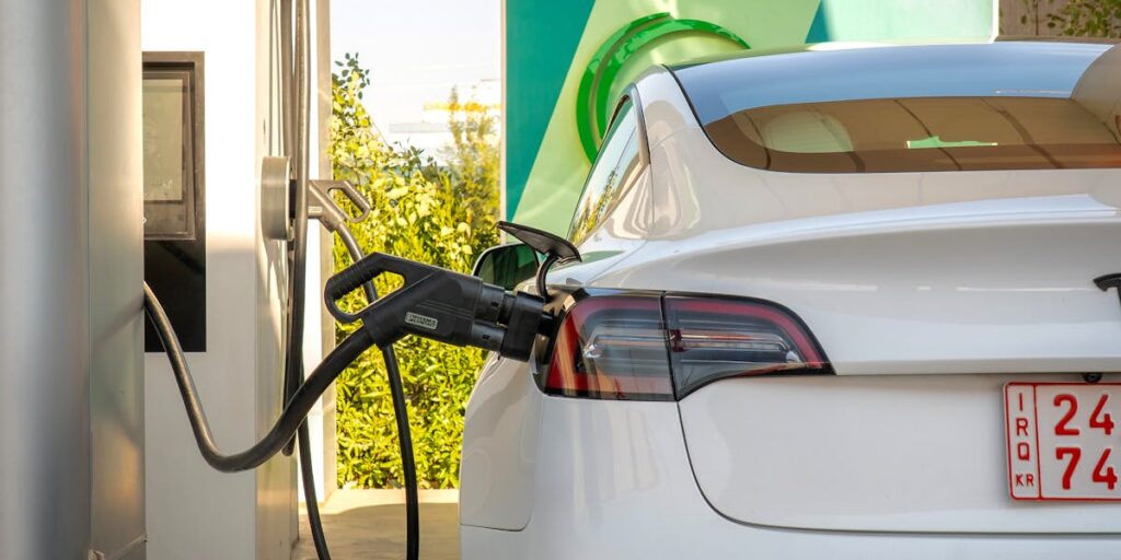 An electric car charging at a station